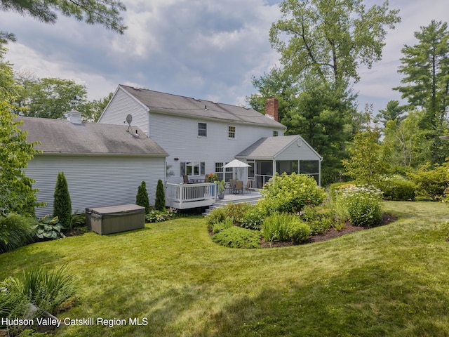 157 Hillside Ter, Kingston, NY 12401 - rear view of house featuring a hot tub, a sunroom, a deck, a chimney, and a yard