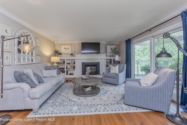 157 Hillside Ter, Kingston, NY 12401 - living area featuring ornamental molding, wood finished floors, and a brick fireplace