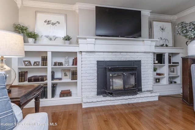 157 Hillside Ter, Kingston, NY 12401 - living room with crown molding, a brick fireplace, and wood finished floors