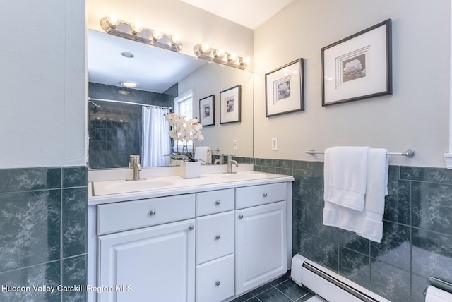 157 Hillside Ter, Kingston, NY 12401 - bathroom featuring tile walls, baseboard heating, double vanity, a tile shower, and tile patterned flooring