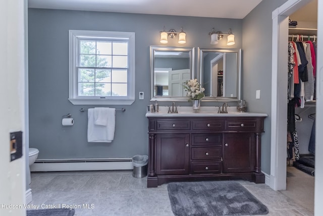 157 Hillside Ter, Kingston, NY 12401 - bathroom with double vanity, a spacious closet, and a baseboard radiator