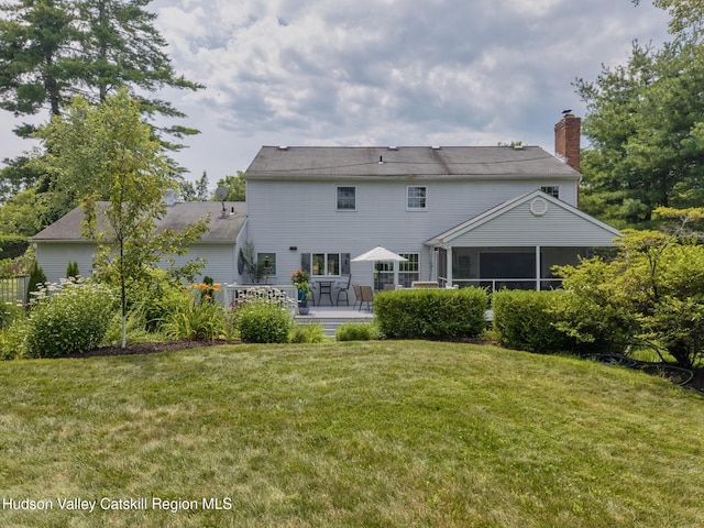 157 Hillside Ter, Kingston, NY 12401 - back of house featuring a sunroom, a yard, a deck, and a chimney