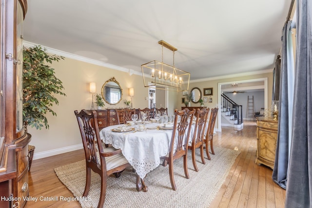 157 Hillside Ter, Kingston, NY 12401 - dining room with stairs, light wood finished floors, and crown molding