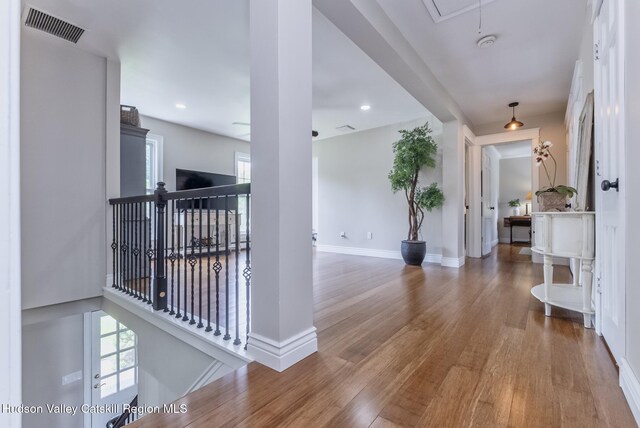 157 Hillside Ter, Kingston, NY 12401 - corridor with wood finished floors, an upstairs landing, and attic access