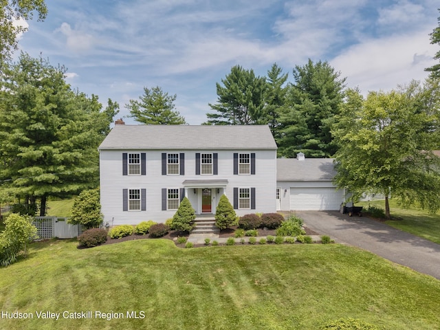 157 Hillside Ter, Kingston, NY 12401 - colonial inspired home with a chimney, asphalt driveway, and a garage