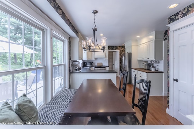 157 Hillside Ter, Kingston, NY 12401 - dining area with a chandelier, wood finished floors, and recessed lighting
