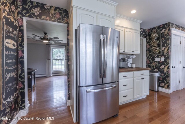 157 Hillside Ter, Kingston, NY 12401 - kitchen with wallpapered walls, freestanding refrigerator, wood finished floors, wooden counters, and white cabinets
