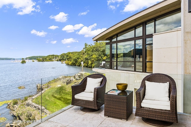 view of patio featuring a water view