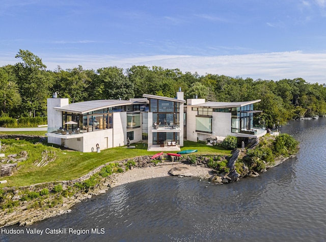 back of house featuring a water view