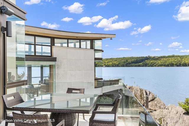 view of patio with a water view