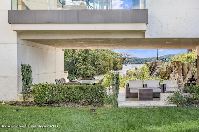 exterior space featuring outdoor lounge area and a mountain view