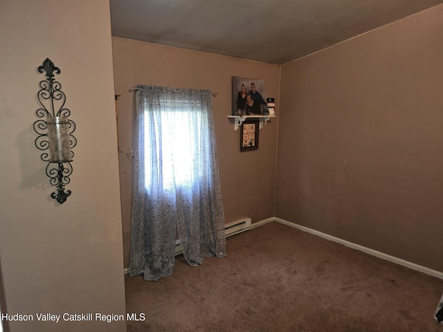 803 County Route 27, Ancram, NY 12502 - spare room with a baseboard heating unit and carpet