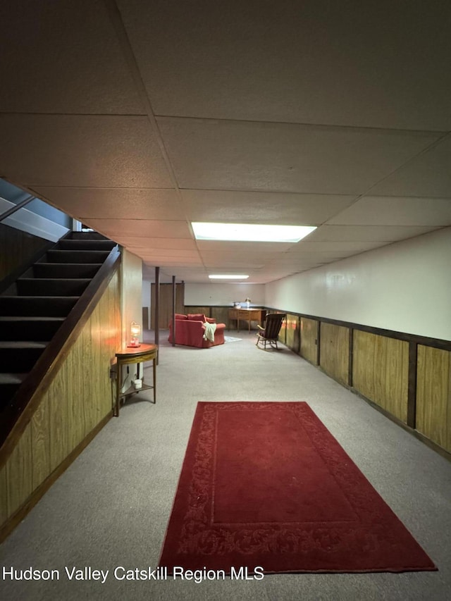 803 County Route 27, Ancram, NY 12502 - finished basement with carpet, stairs, and a paneled ceiling