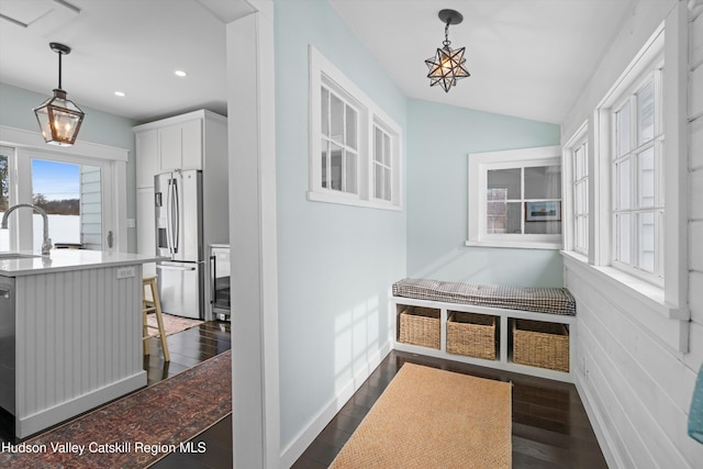 mudroom featuring vaulted ceiling, dark hardwood / wood-style flooring, and sink