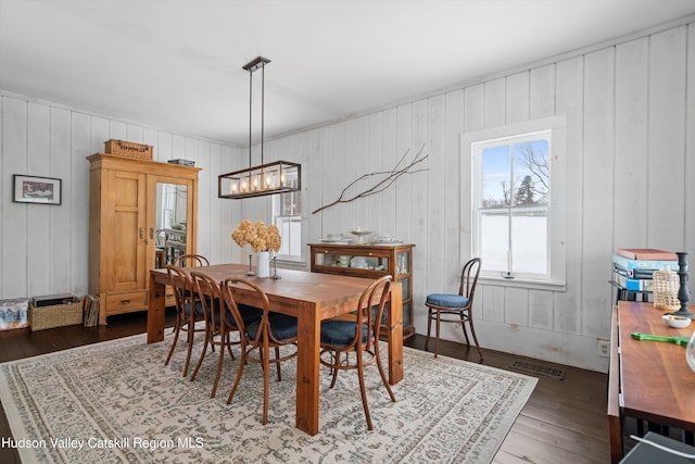 dining room with dark hardwood / wood-style flooring