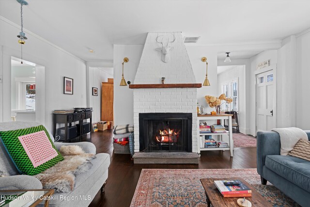 living room with a fireplace and dark hardwood / wood-style floors