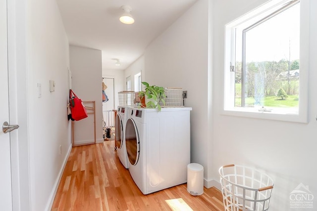 54 Mercer Mountain Rd, East Chatham, NY 12060 - clothes washing area with washer and dryer, light wood-style flooring, and baseboards