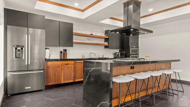 7717 Main St, Hunter, NY 12442 - kitchen with appliances with stainless steel finishes, island range hood, dark countertops, crown molding, and recessed lighting