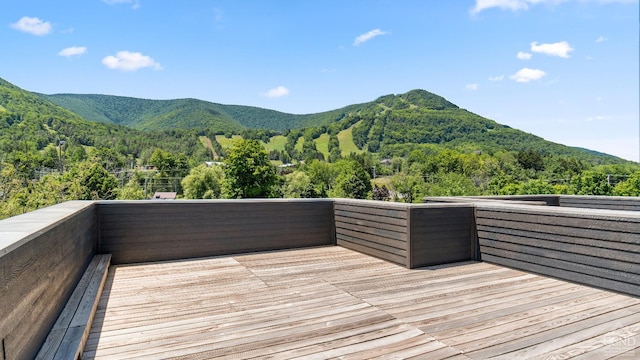 7717 Main St, Hunter, NY 12442 - wooden deck featuring a mountain view and a view of trees