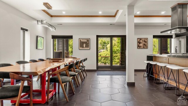 7717 Main St, Hunter, NY 12442 - dining room featuring baseboards, recessed lighting, crown molding, and a raised ceiling