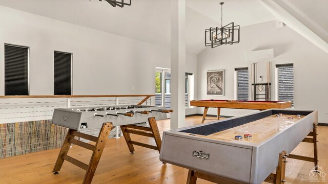 7717 Main St, Hunter, NY 12442 - game room with wood finished floors, high vaulted ceiling, and a chandelier