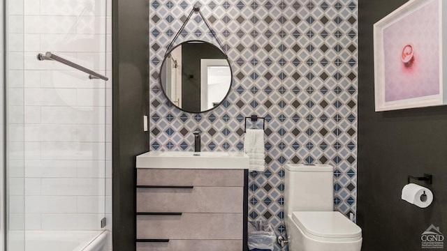 7717 Main St, Hunter, NY 12442 - bathroom featuring toilet, vanity, and washtub / shower combination