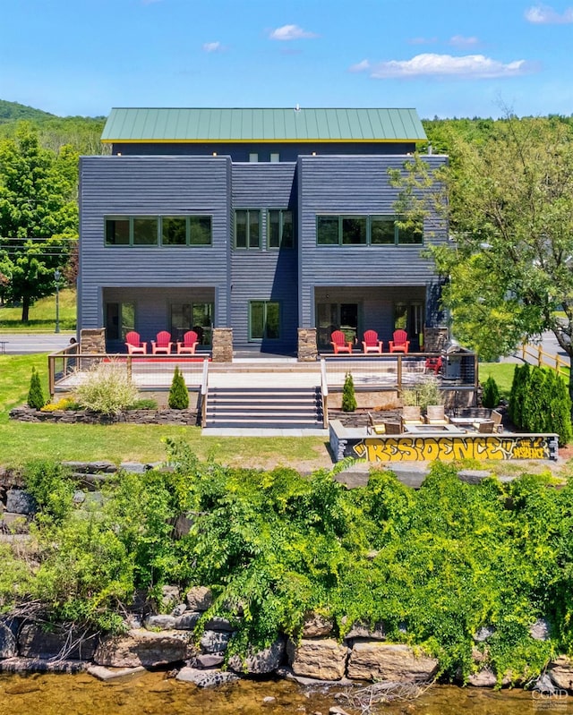 7717 Main St, Hunter, NY 12442 - back of house with a standing seam roof and metal roof