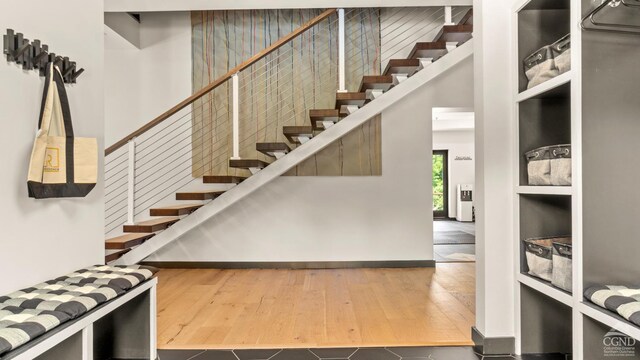 7717 Main St, Hunter, NY 12442 - stairway with hardwood / wood-style flooring and baseboards