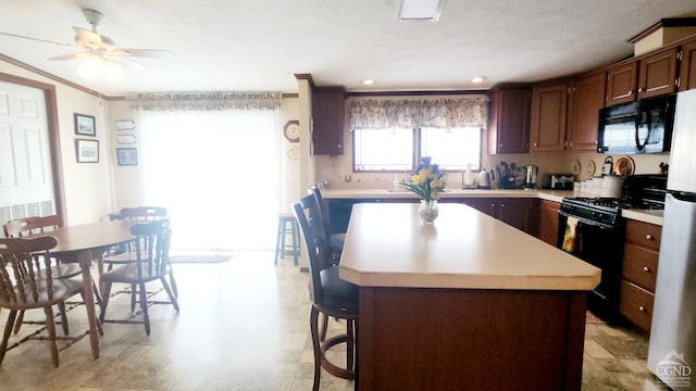 76 Gibson Rd, Durham, NY 12423 - kitchen featuring black appliances, a center island, light countertops, a ceiling fan, and recessed lighting