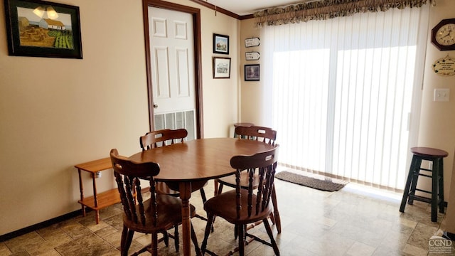 76 Gibson Rd, Durham, NY 12423 - dining space with baseboards, ornamental molding, and stone finish floors