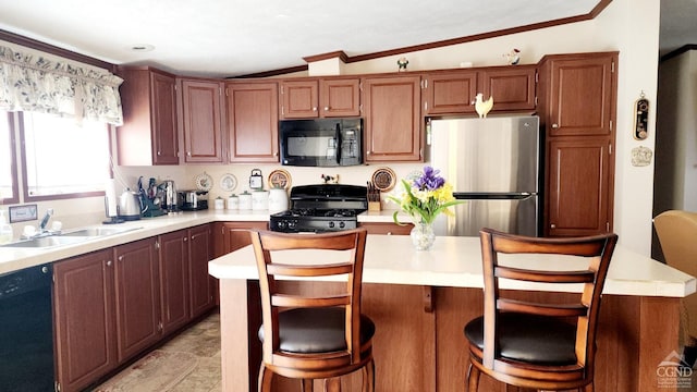 76 Gibson Rd, Durham, NY 12423 - kitchen with black appliances, light countertops, a sink, ornamental molding, and a kitchen bar