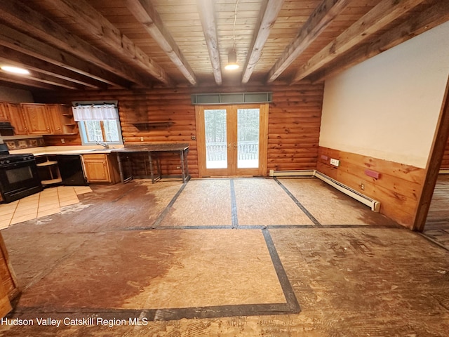 interior space with sink, beamed ceiling, a baseboard heating unit, black appliances, and french doors