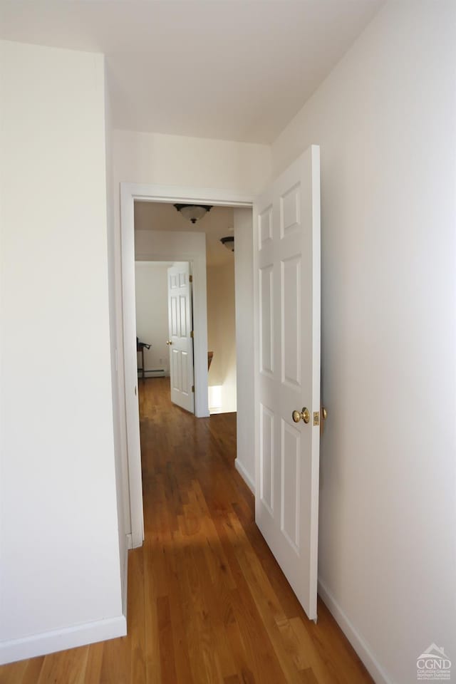 147 Skyview, Greenville, NY 12083 - hall with wood finished floors, baseboards, and a baseboard radiator