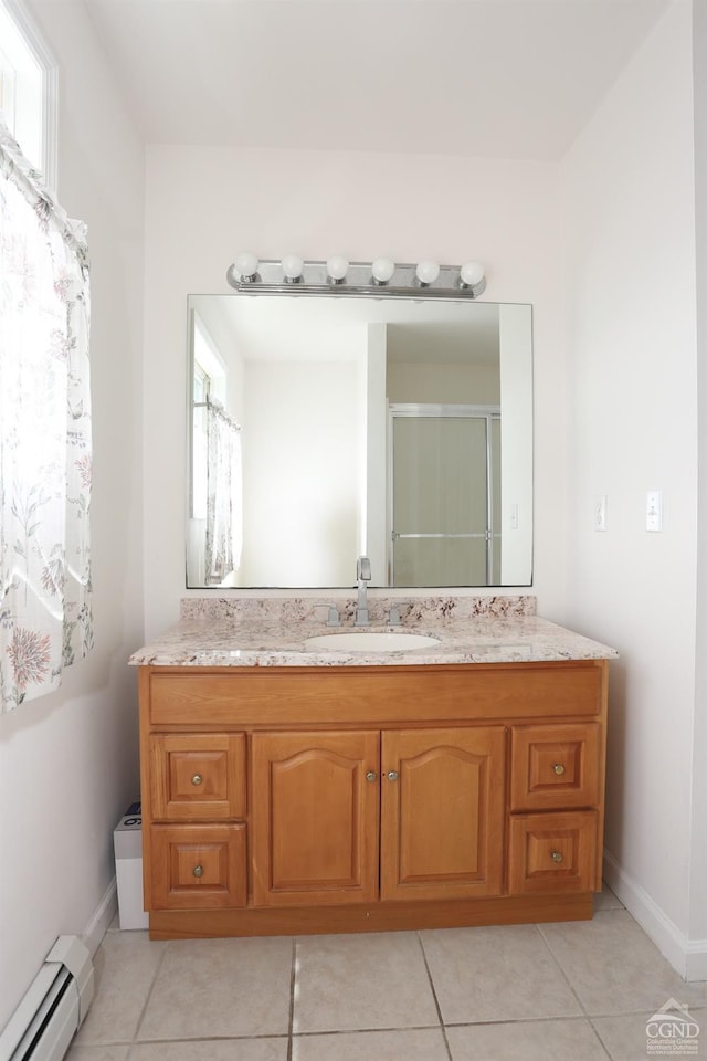 147 Skyview, Greenville, NY 12083 - bathroom featuring a baseboard radiator, tile patterned floors, vanity, and baseboards