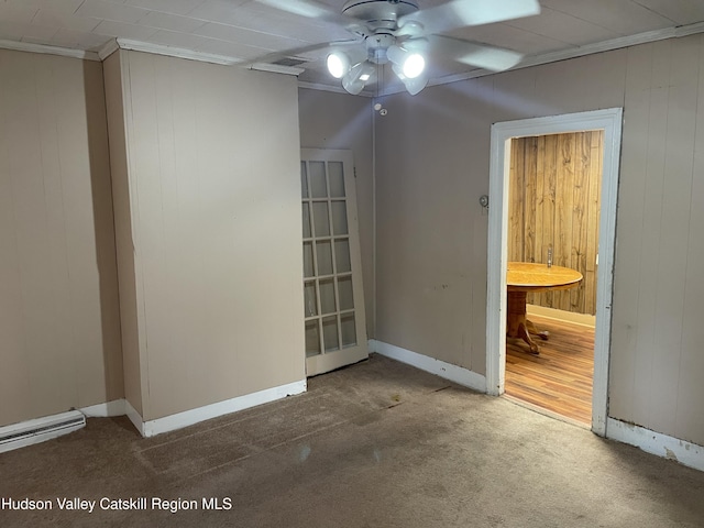 63 Gill St, Kingston, NY 12401 - carpeted spare room featuring ceiling fan, baseboards, wood walls, and ornamental molding