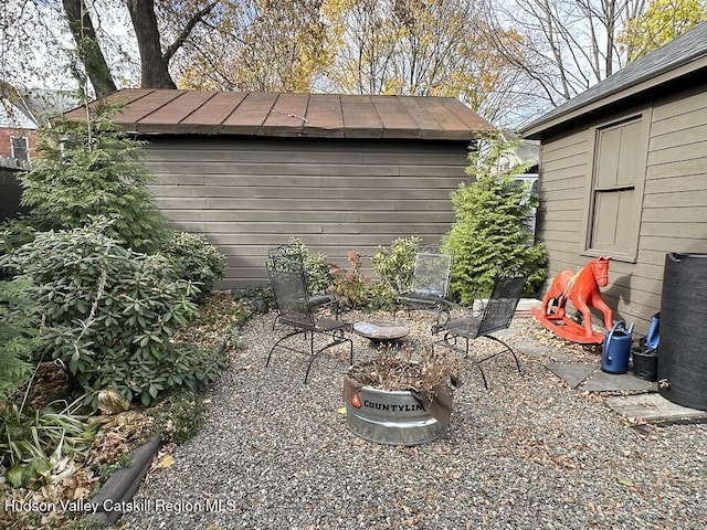 view of patio / terrace featuring a storage shed
