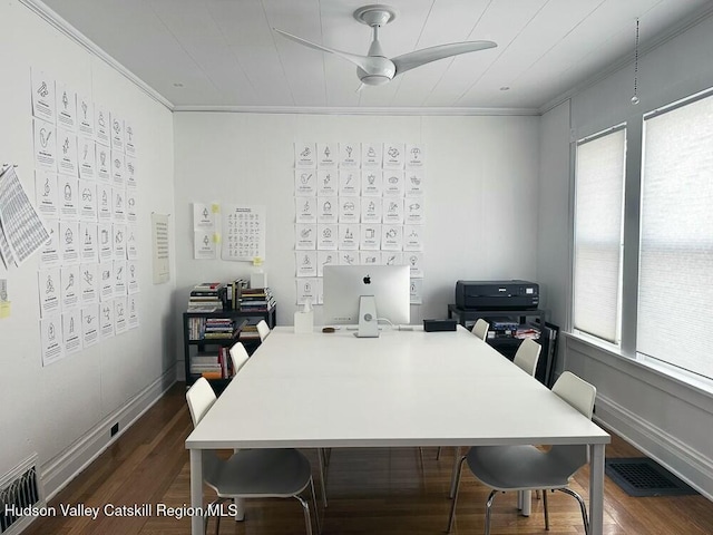 office space featuring dark wood-type flooring, a healthy amount of sunlight, and ornamental molding