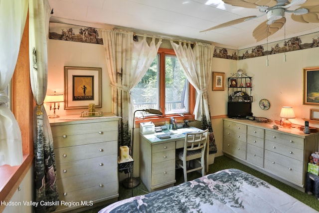 bedroom featuring dark colored carpet and ceiling fan