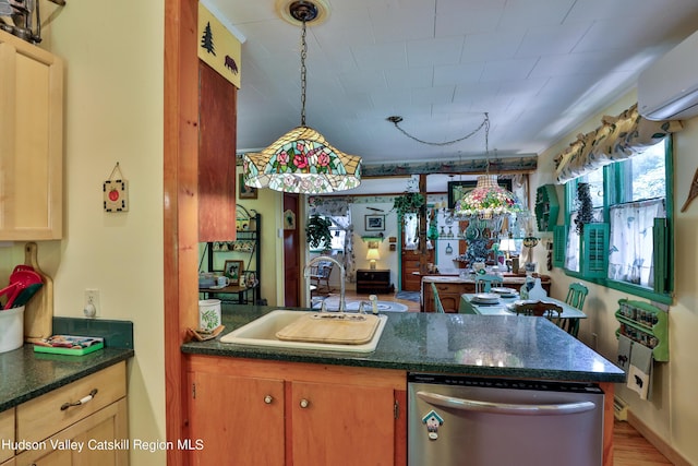 kitchen with sink, wood-type flooring, decorative light fixtures, an AC wall unit, and dishwasher