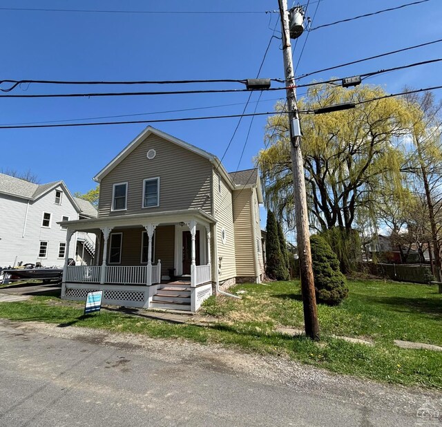 15 N Warren St, Athens, NY 12015 - view of front of home featuring a porch and a front yard