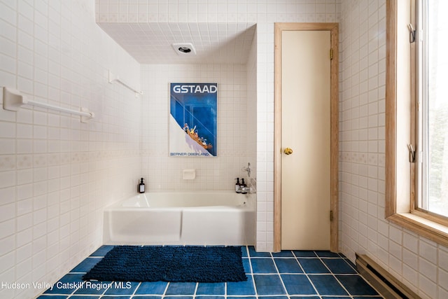 full bath with tile patterned flooring, a baseboard radiator, bathtub / shower combination, and tile walls