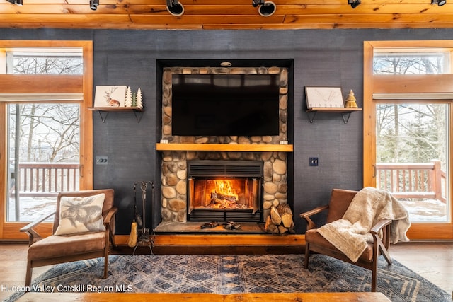 sitting room featuring a fireplace and wood finished floors