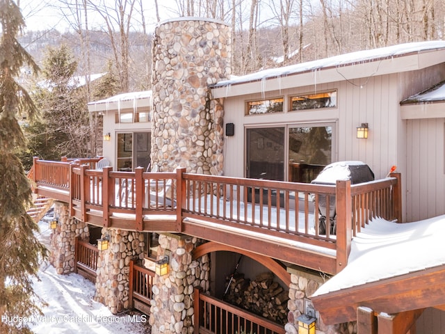 snow covered deck featuring grilling area