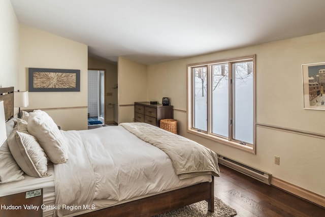 bedroom with lofted ceiling, a baseboard radiator, dark wood finished floors, and baseboards