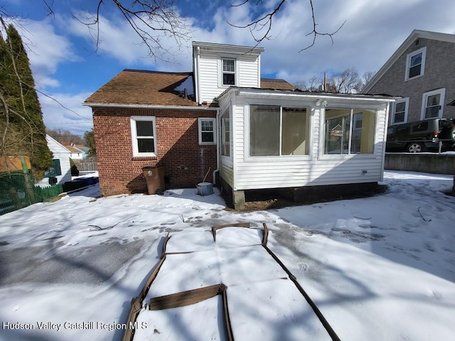 view of snow covered house