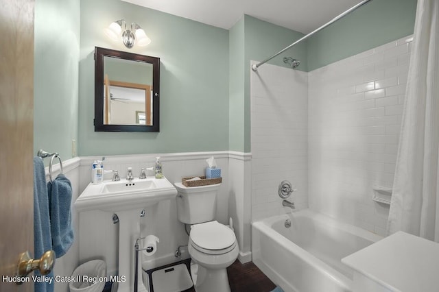 16 Wang Dr, Copake, NY 12516 - bathroom featuring shower / bathtub combination with curtain, wainscoting, and wood finished floors