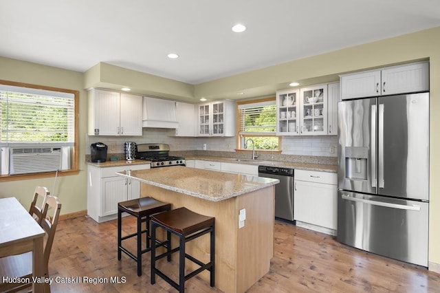 16 Wang Dr, Copake, NY 12516 - kitchen with stainless steel appliances, a center island, decorative backsplash, custom exhaust hood, and recessed lighting