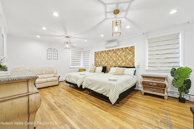 bedroom with recessed lighting, light wood finished floors, a wall mounted AC, and baseboard heating