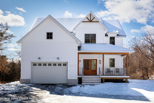 modern farmhouse style home featuring a garage, a porch, and board and batten siding