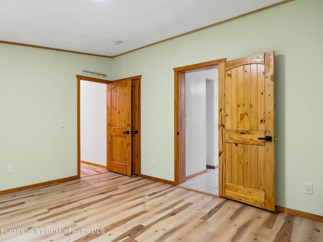 719 Allen Teator Rd, Durham, NY 12469 - unfurnished bedroom featuring wood finished floors and crown molding